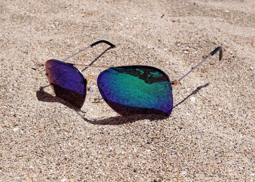 Photo by webandi sunglasses, sand, beach
